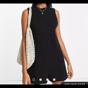 Black sleeveless minimal play suit in waffle